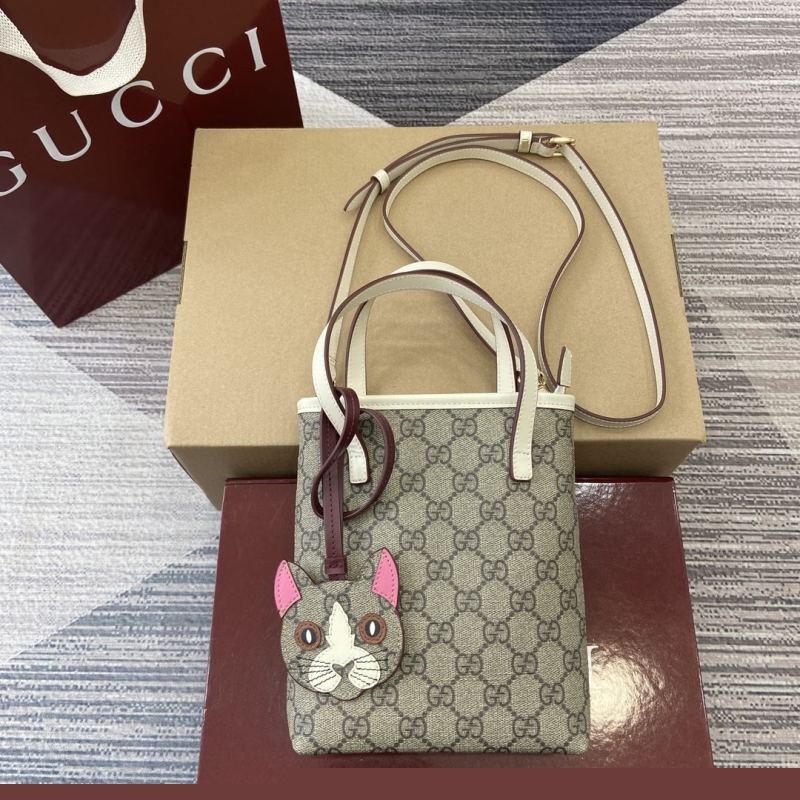 G*u*i top handle bags